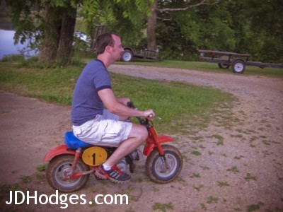 Riding the Honda mini bike at the lake