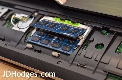 Gently slide the new memory module(s) into their slots at the appropriate angle (to module shown here)