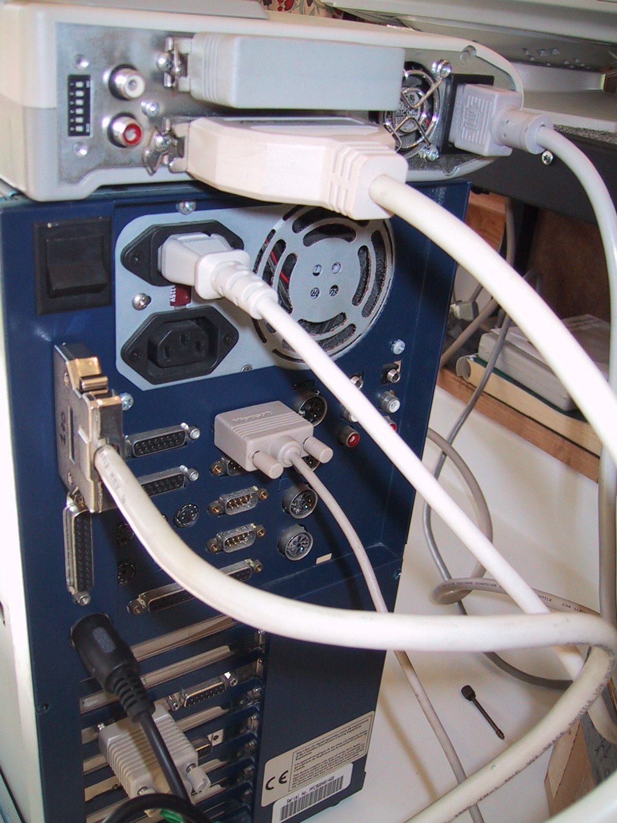 BeBox back panel close-up showing the GeekPort 37-pin D-shell connector, serial ports, MIDI DIN, and RCA audio jacks