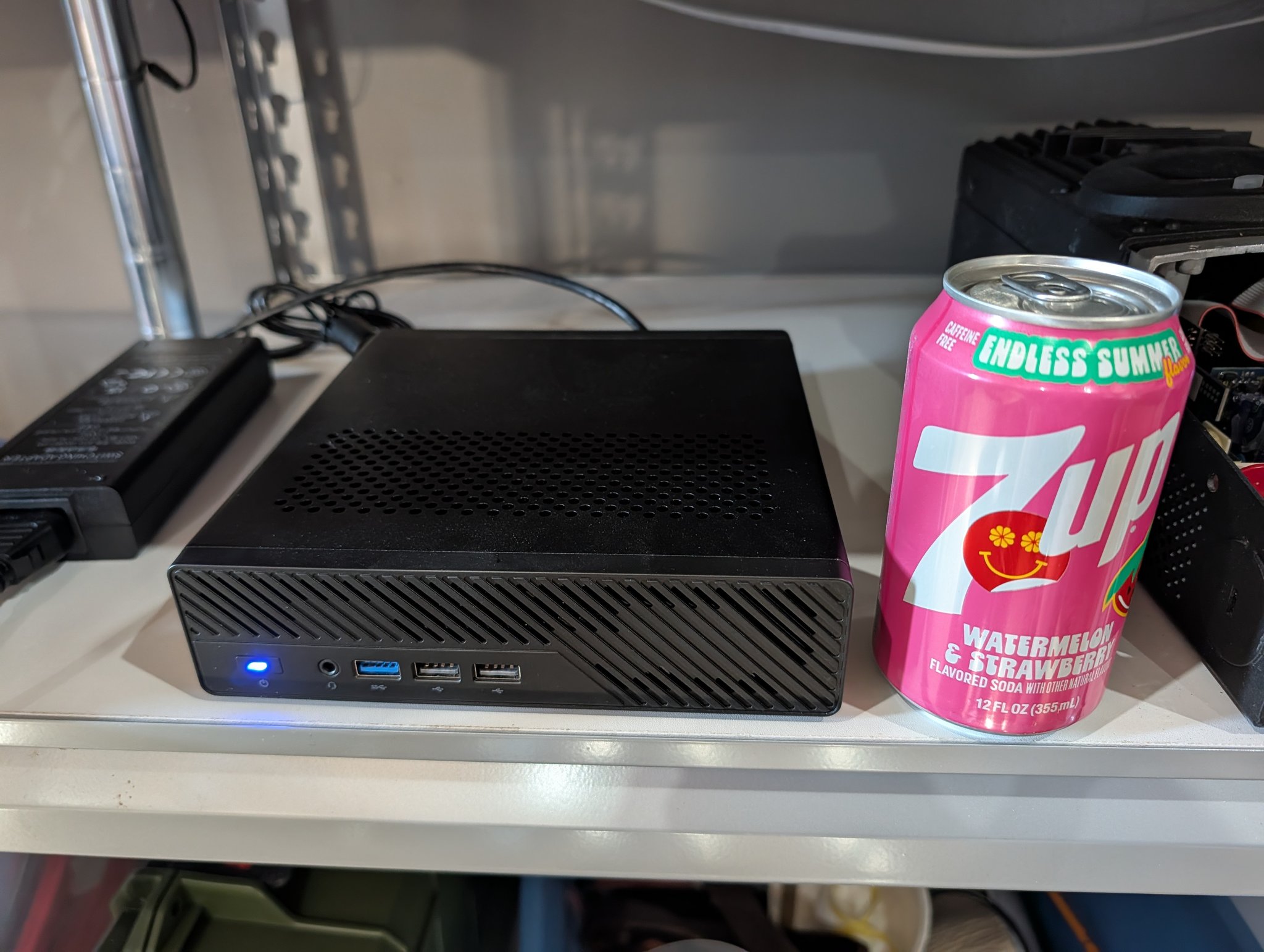 Minisforum MS-01 mini PC next to a 7UP can for size comparison