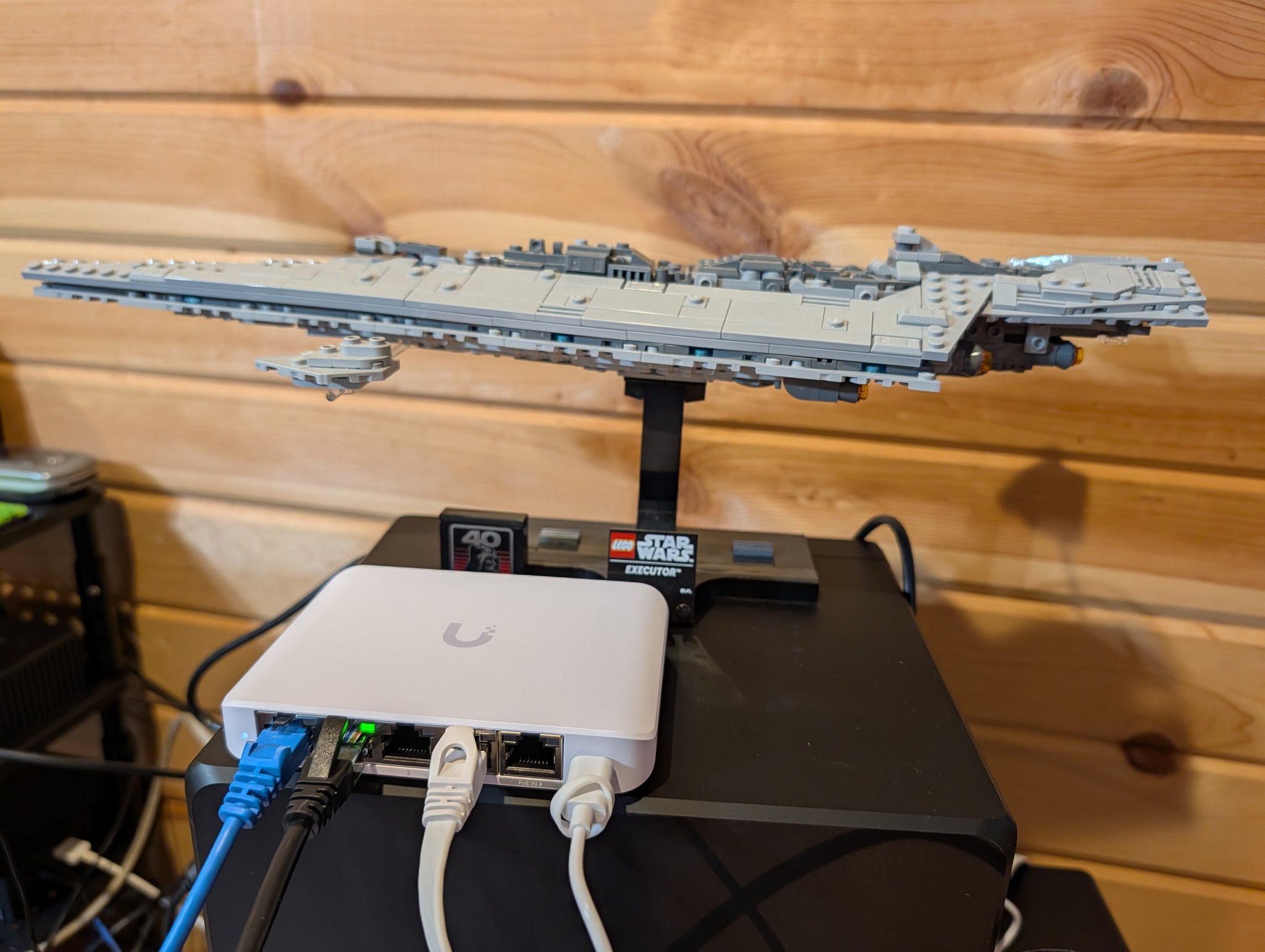 Synology DS925+ connected to a Ubiquiti USW-Flex-2.5G-5 switch with a LEGO Star Destroyer sitting on top