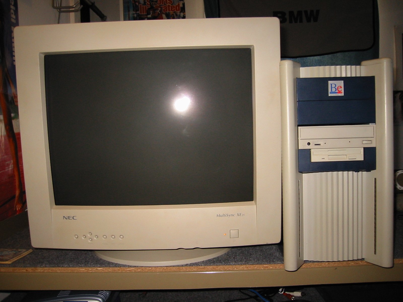 BeBox tower next to NEC MultiSync XE21 monitor with screen off, sale-week desk setup November 2001