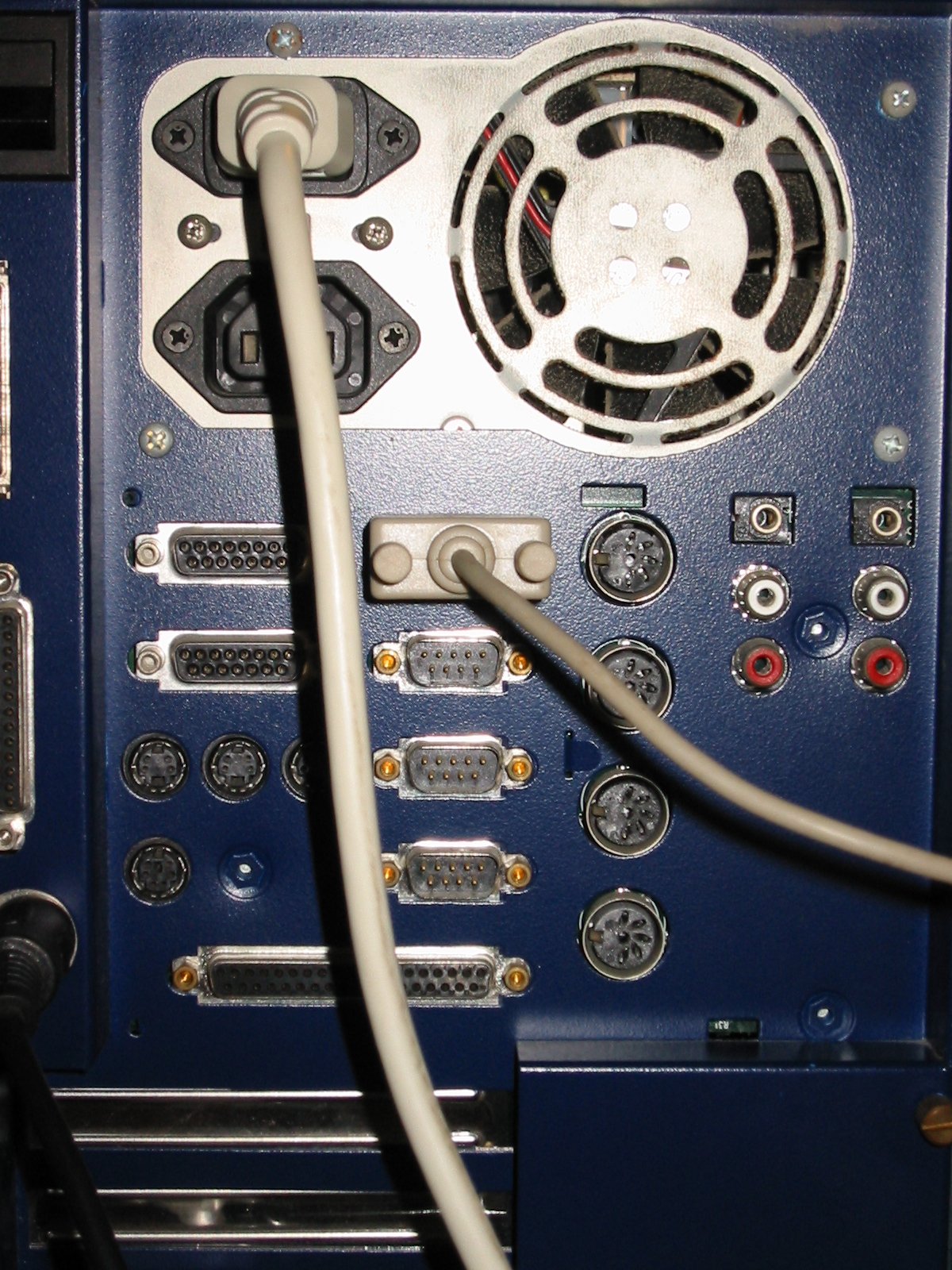 BeBox back panel without any cables connected showing GeekPort, four serial ports, MIDI DIN cluster, RCA audio, PS/2, and parallel